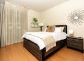 Thumbnail 25 of 75 - a bedroom with a bed and two night stands